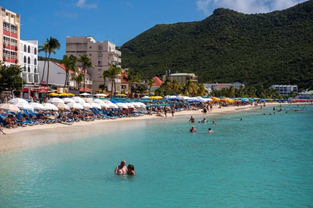 Beach chairs and turquoise water at Great Bay Beach in St. Maarten